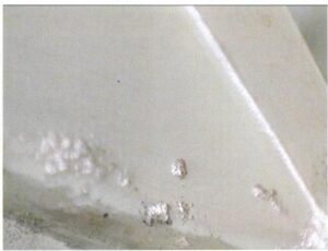 Figure 6-40 slag inclusion on the surface of the pendant