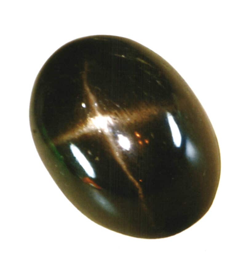 Diopside cross pattern stone