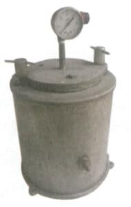 Figur 1-28 Pneumatisk voksinjeksjonsmaskin