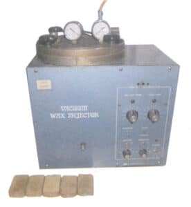 Figur 1-29 Vakuumvoksinjeksjonsmaskin