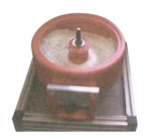 Figur 1-46 Vibrasjonspoleringsmaskin