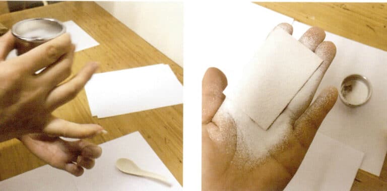 2. Place the dried white glaze into a basket and evenly sprinkle it onto the moist copper sheet.