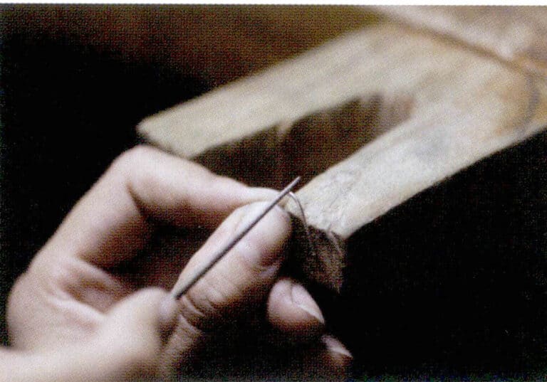 2. Use a round file to grind a slot below the bottom of a u shape for welding.