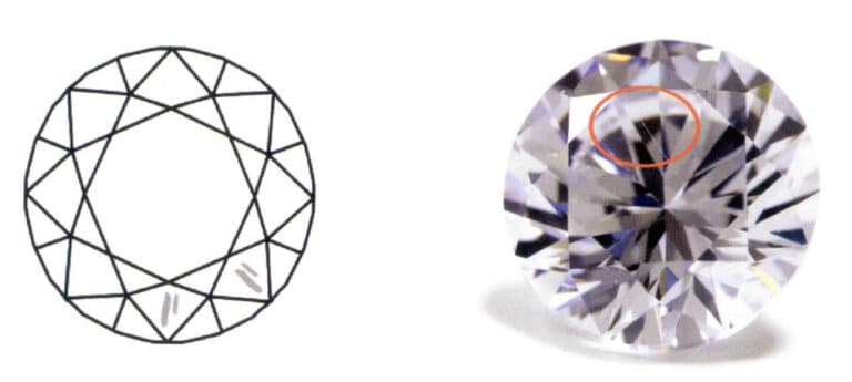 図9-25 損傷した石（灰色の部分）