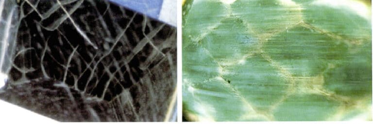 Figure 5-18 Coated emerald surfaces often produce net-like and radiating surface growth fissures.
