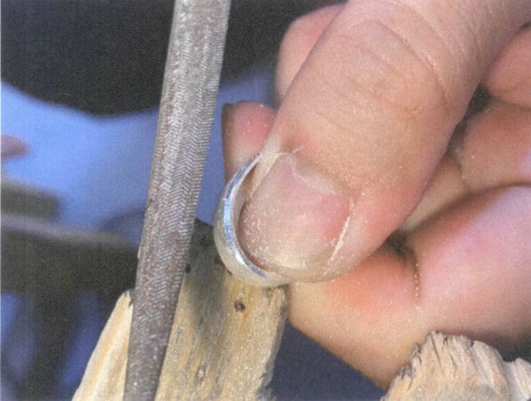 Figure 2-22 Grinding the slanted surface of the metal edge