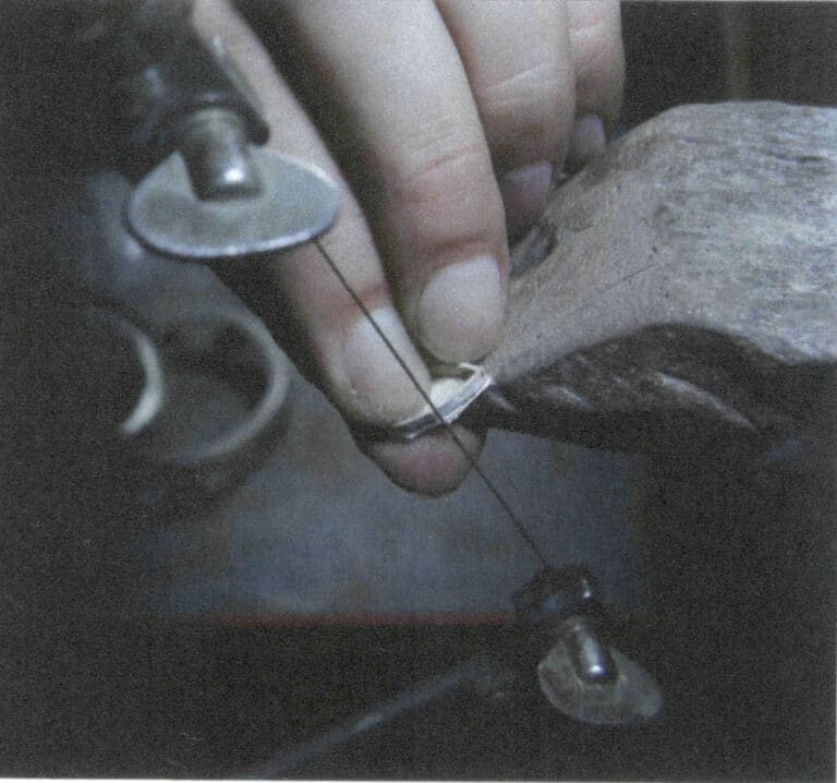 Figure 2-43 Sawing off the excess metal base on the outside