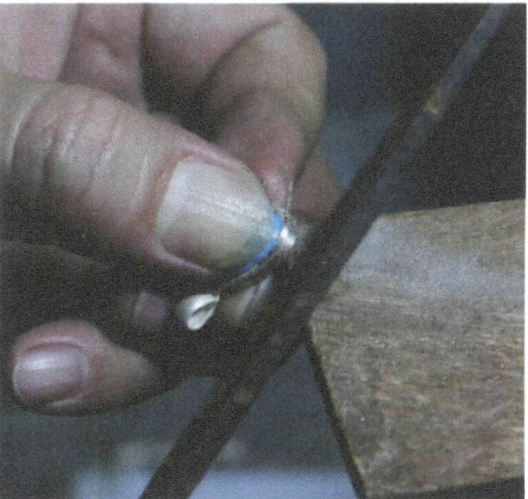 Figure 2-54 Trimming the outer metal edge of the metal