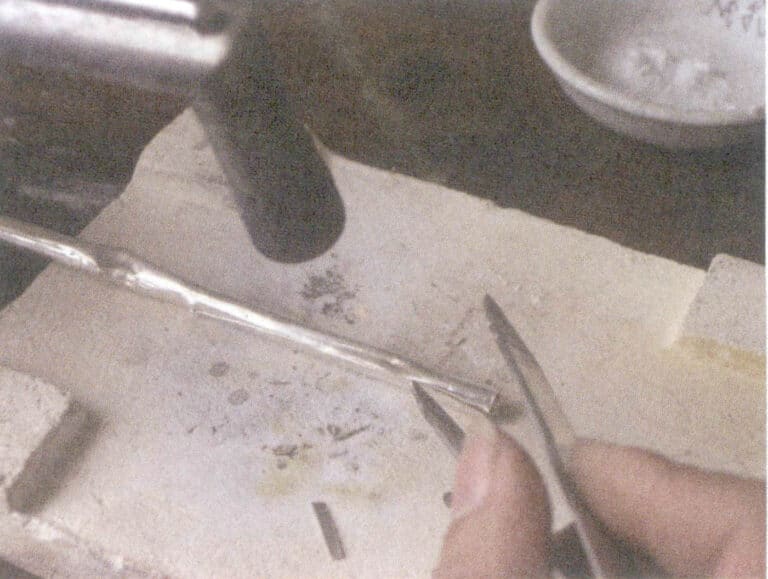 Figure 8-10 Welding the pipe