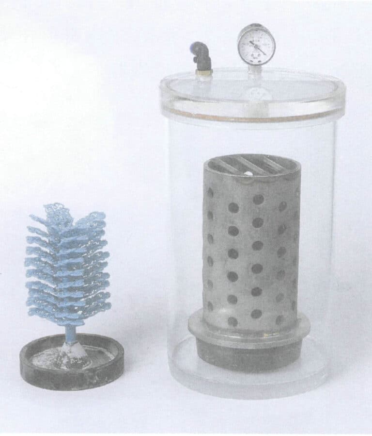 Figure 5-22 Wax model tree, steel flask, and grouting bucket