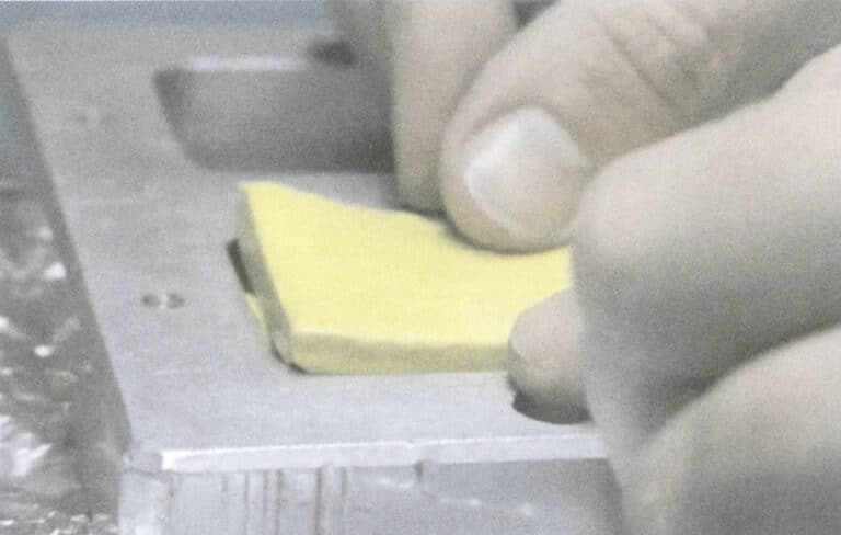 Figure 2-18 Filling and Pressing Raw Rubber