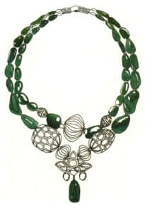 Step 05 Apply base layers to gemstones using emerald green, sap green, and cerulean blue, avoiding over-saturation.