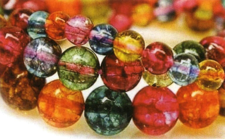 Tourmaline with many fissures and filled with colored resin