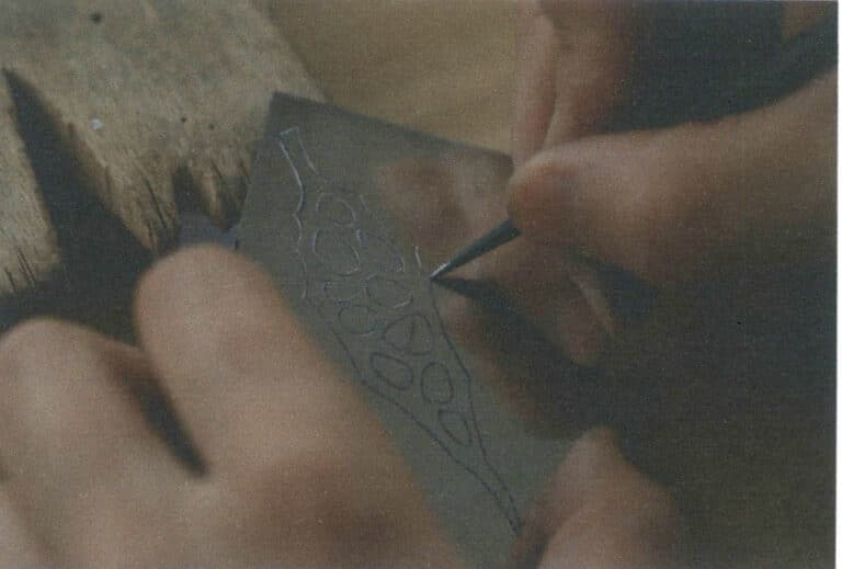 Figure 7-14 Drawing pattern lines on the silver base plate with a metal stylus