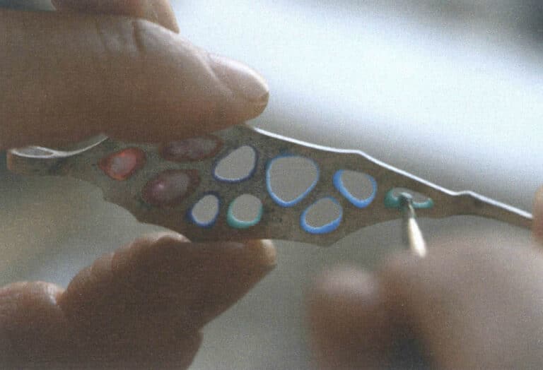 Figure 7-31 Continuing to add other colored glazes onto a test piece filled with red glaze