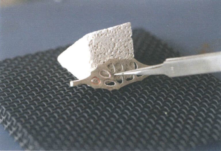 Figure 7–35 Checking the enamel glaze condition with the tip of tweezers