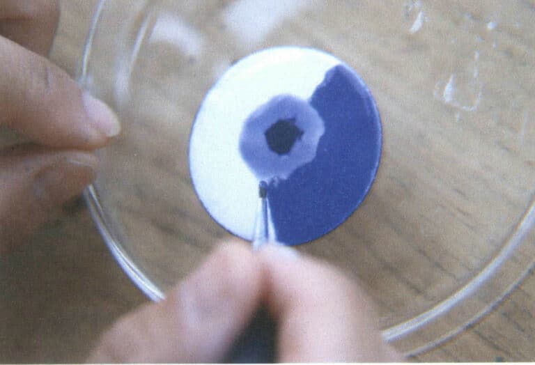 Figure 9-23 A thin layer of other glaze applied over the fired white glaze