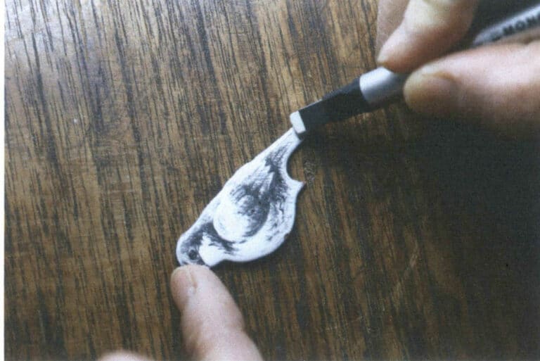 Figure 9-38 Erasing pencil marks that need modification with a rubber eraser