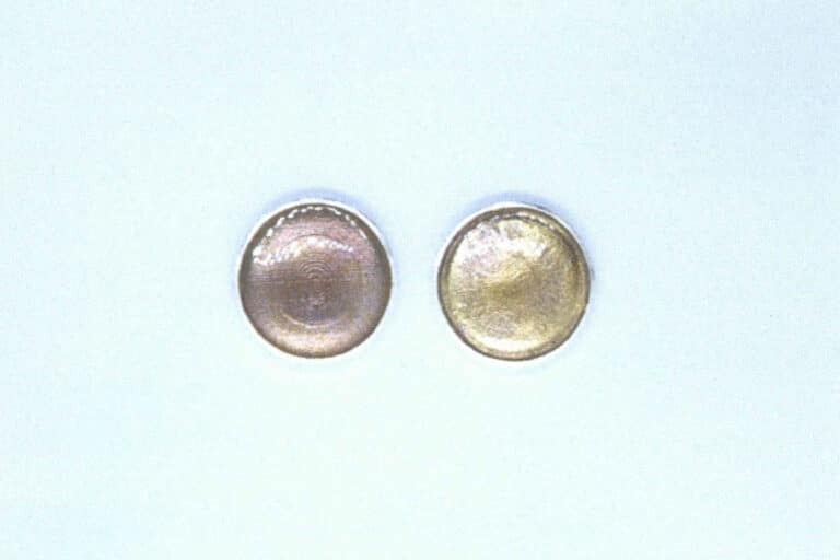 Figure 1-19 Comparison of a transparent light-purple enamel fired on pure silver and on 24K gold substrates