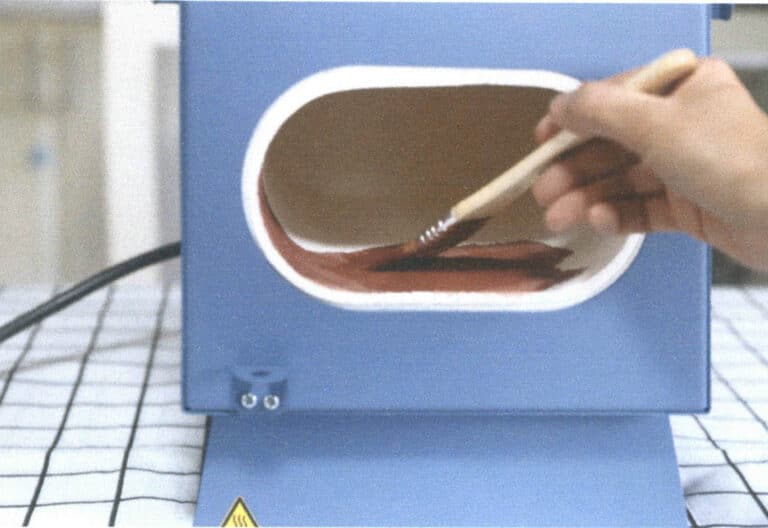 Figure 2–6 Brushing ochre powder