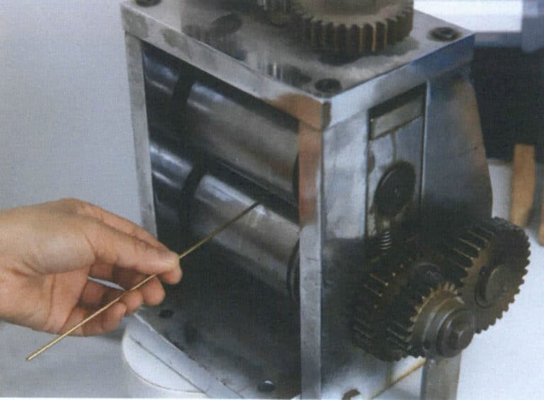 Figure 2–38 Flattening one end of a brass wire with a press machine