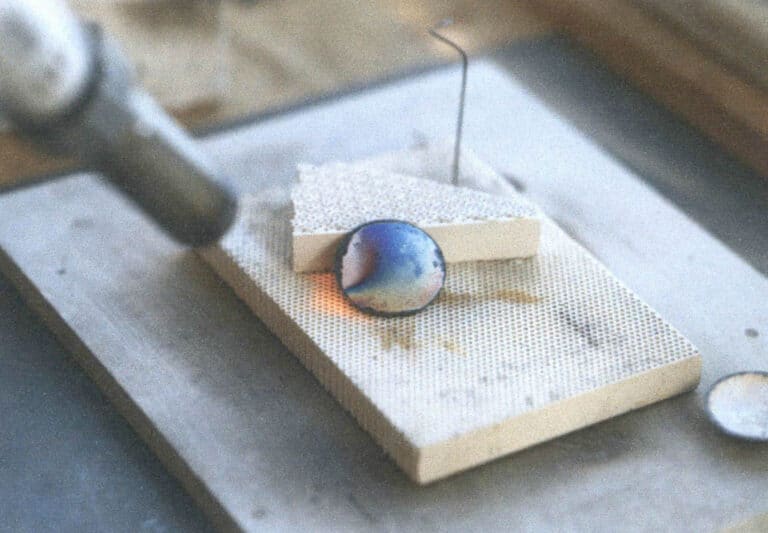 Figure 4–8 Annealing the metal base plate with a welding torch