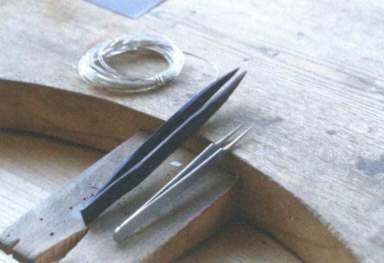 Figure 5-14 Wire-twisting tweezers (left)