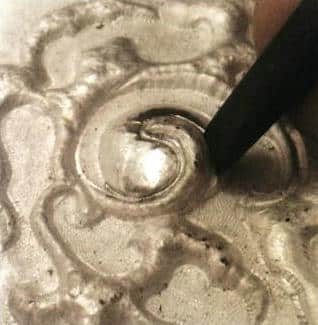 Figure 5-27 Curled section in relief work of the bent chisel