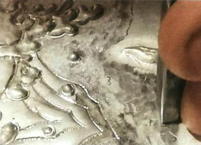 Figure 5-45 Using a square embossing chisel to chase the shape starting from the base layer